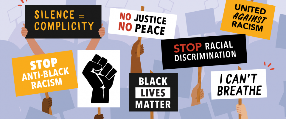 Protest signs at an anti-Black racism rally