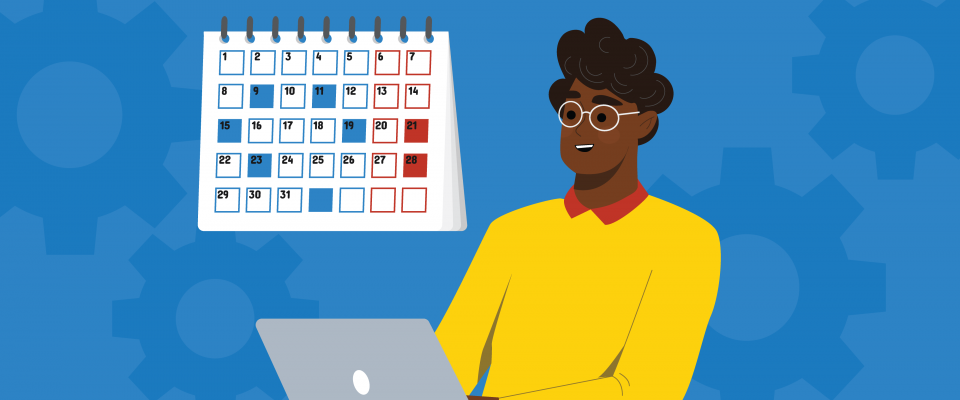 Personne travaillant sur un portable devant un calendrier. 