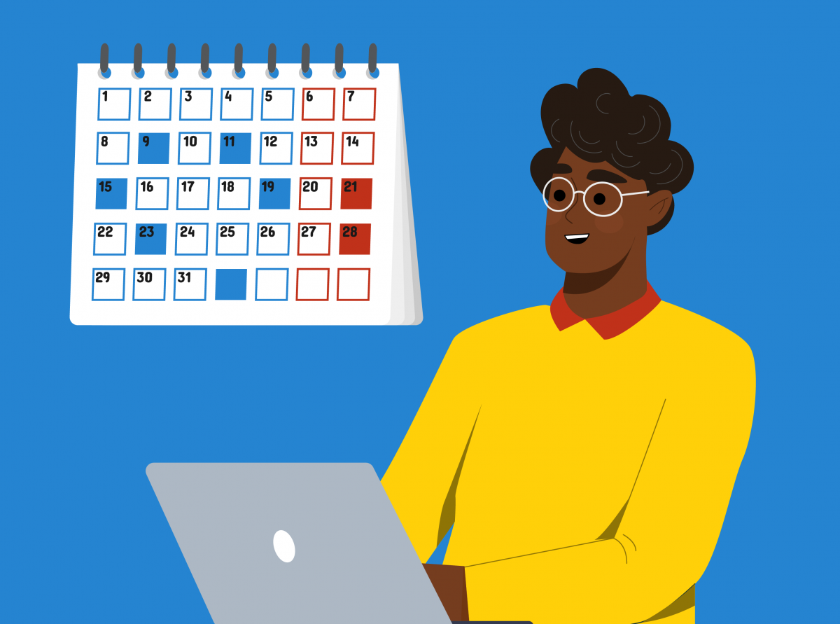 Personne travaillant sur un portable devant un calendrier.